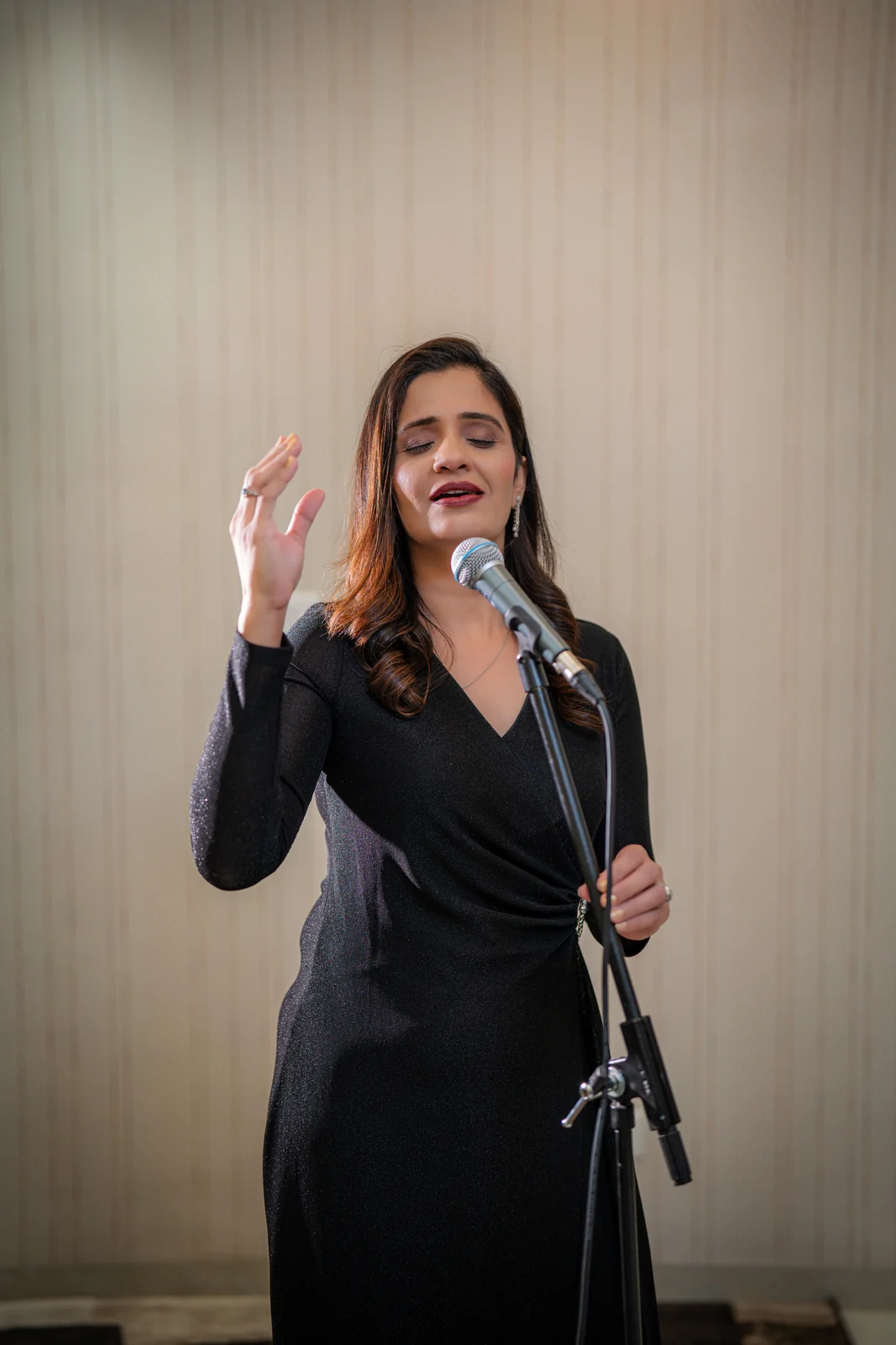 A SwarSampada vocalist performing live at an event