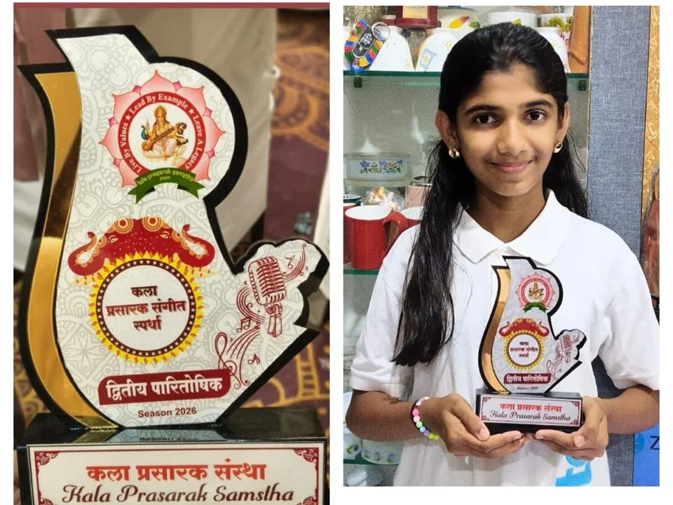 Kala Prasarak Sanstha award trophy and a student holding it