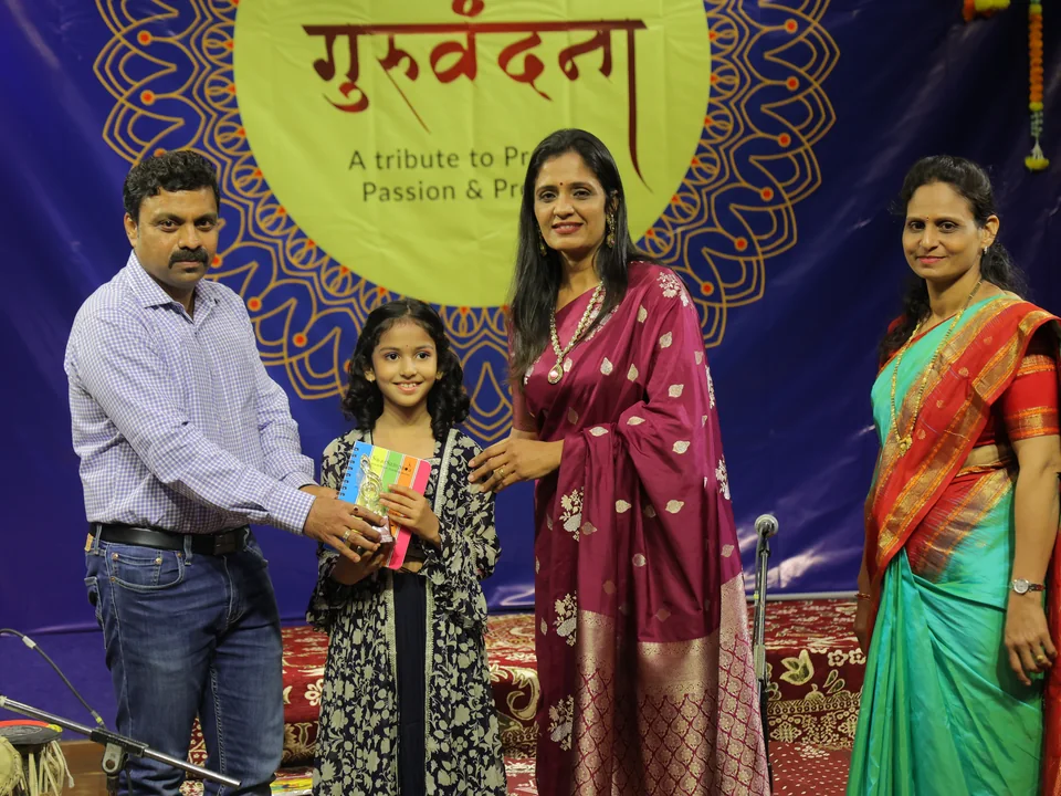 Prize presentation on stage at Guruvandana